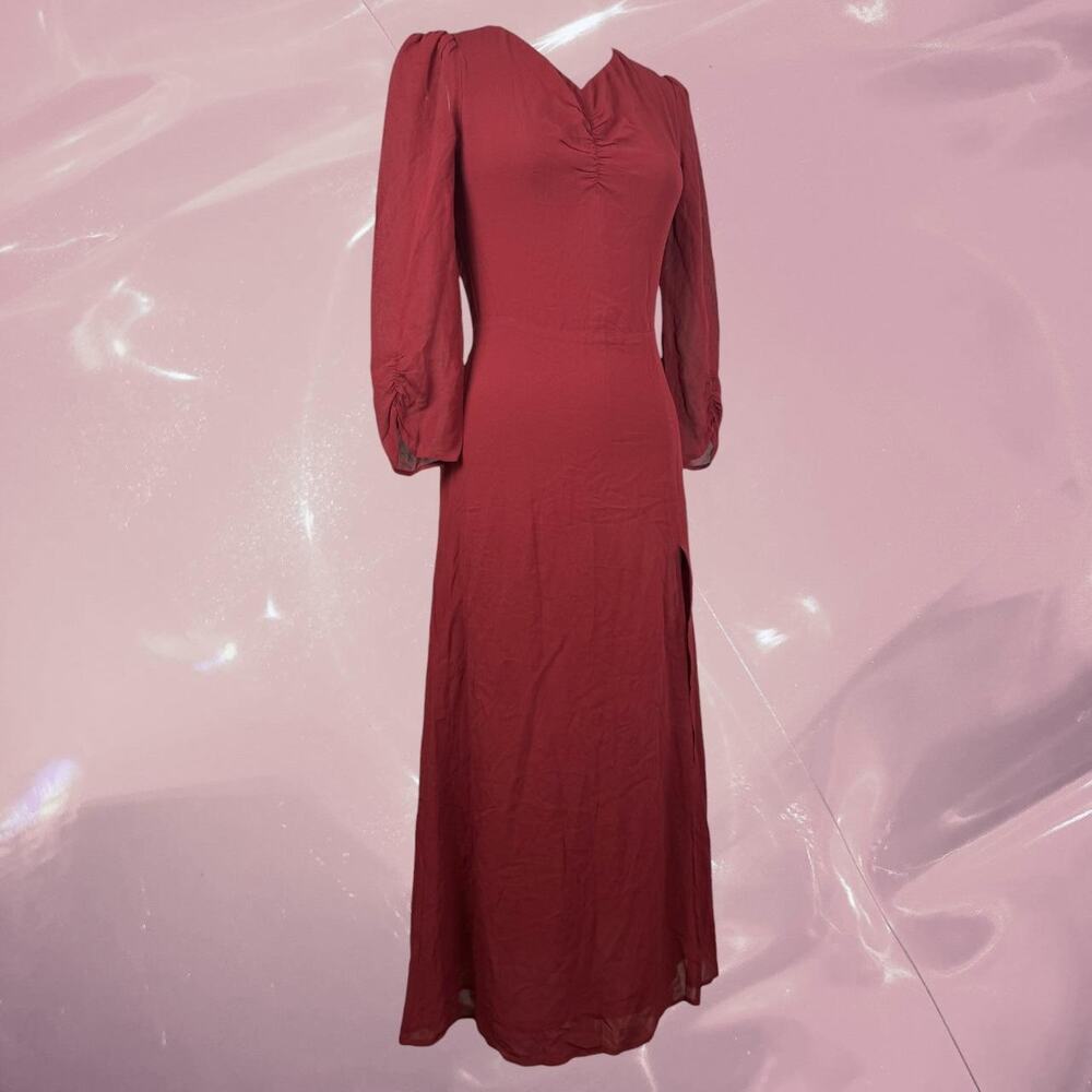 Reformation red maxi dress with ruched sleeves and side slit.